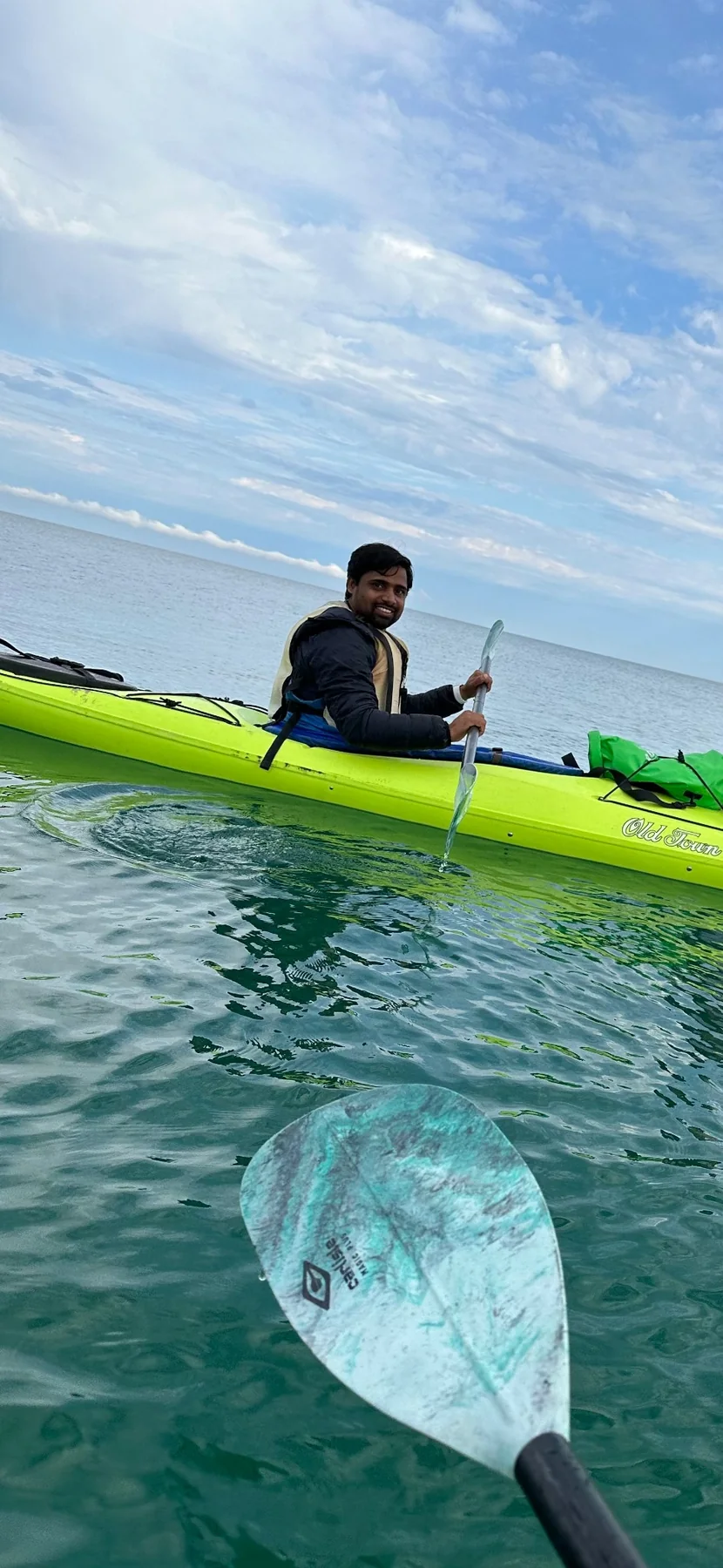 Ravi Teja Alli kayaking on open water